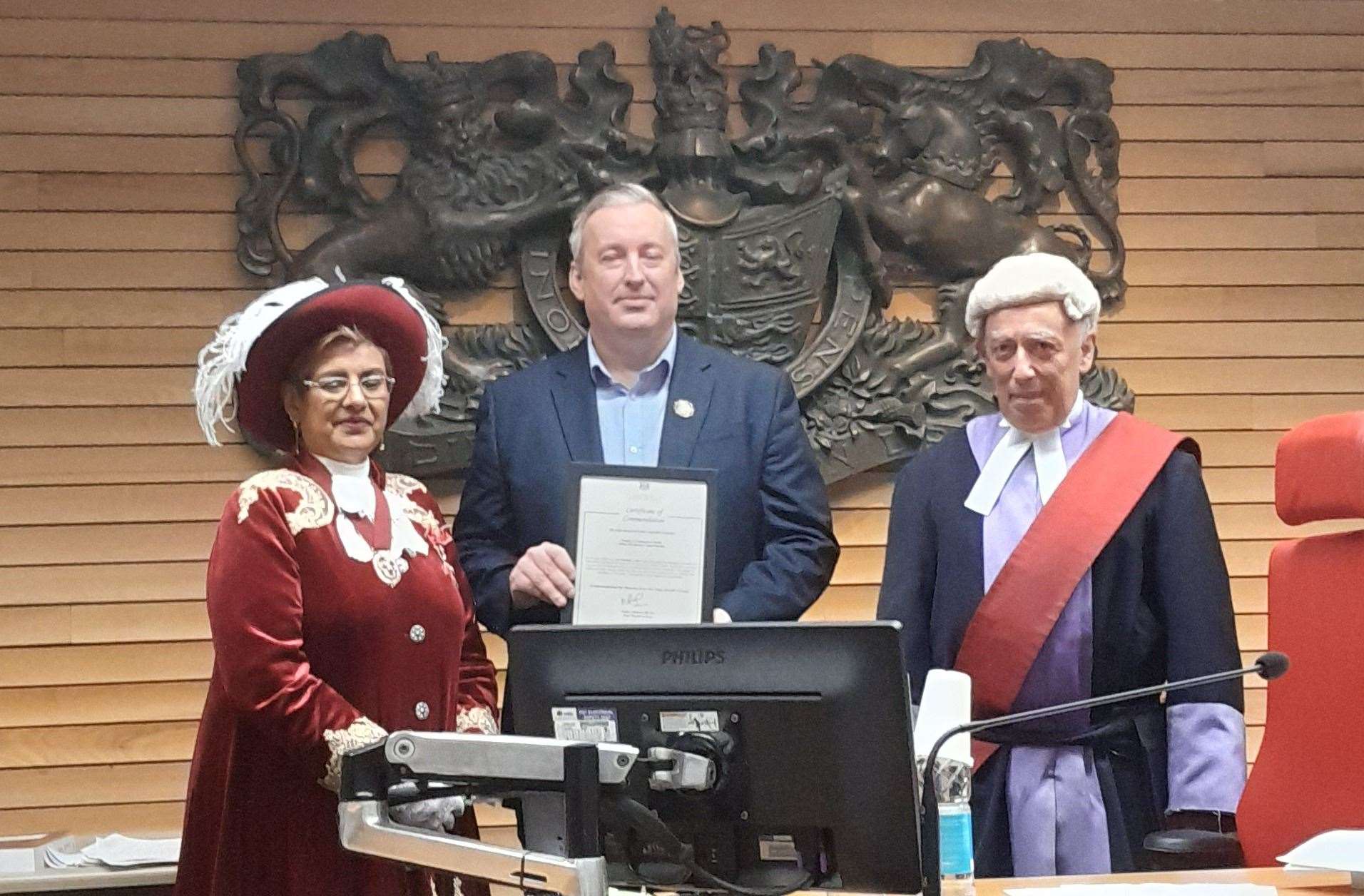 From left: High Sheriff of Kent Nadra Ahmed presents a bravery award to Lee Hawkes watched by Judge Philip Statman at Maidstone Crown Court