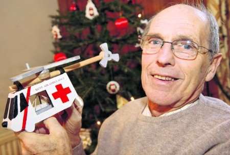 Michael Lutener with a model of the air ambulance