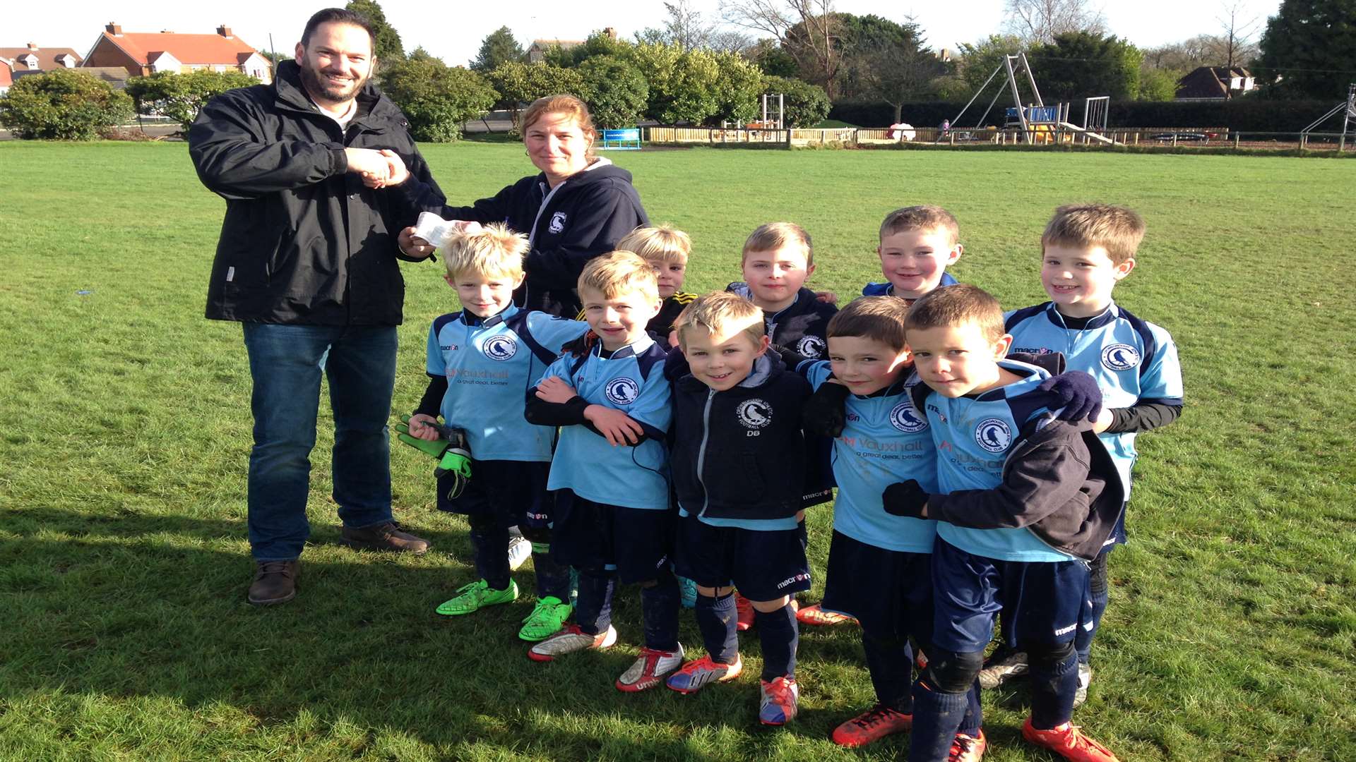 Jonathan Tatlock, from SLM Vauxhall in Tunbridge Wells, with Crowborough Athletic Youth under-7s and manager Sharon Hammond