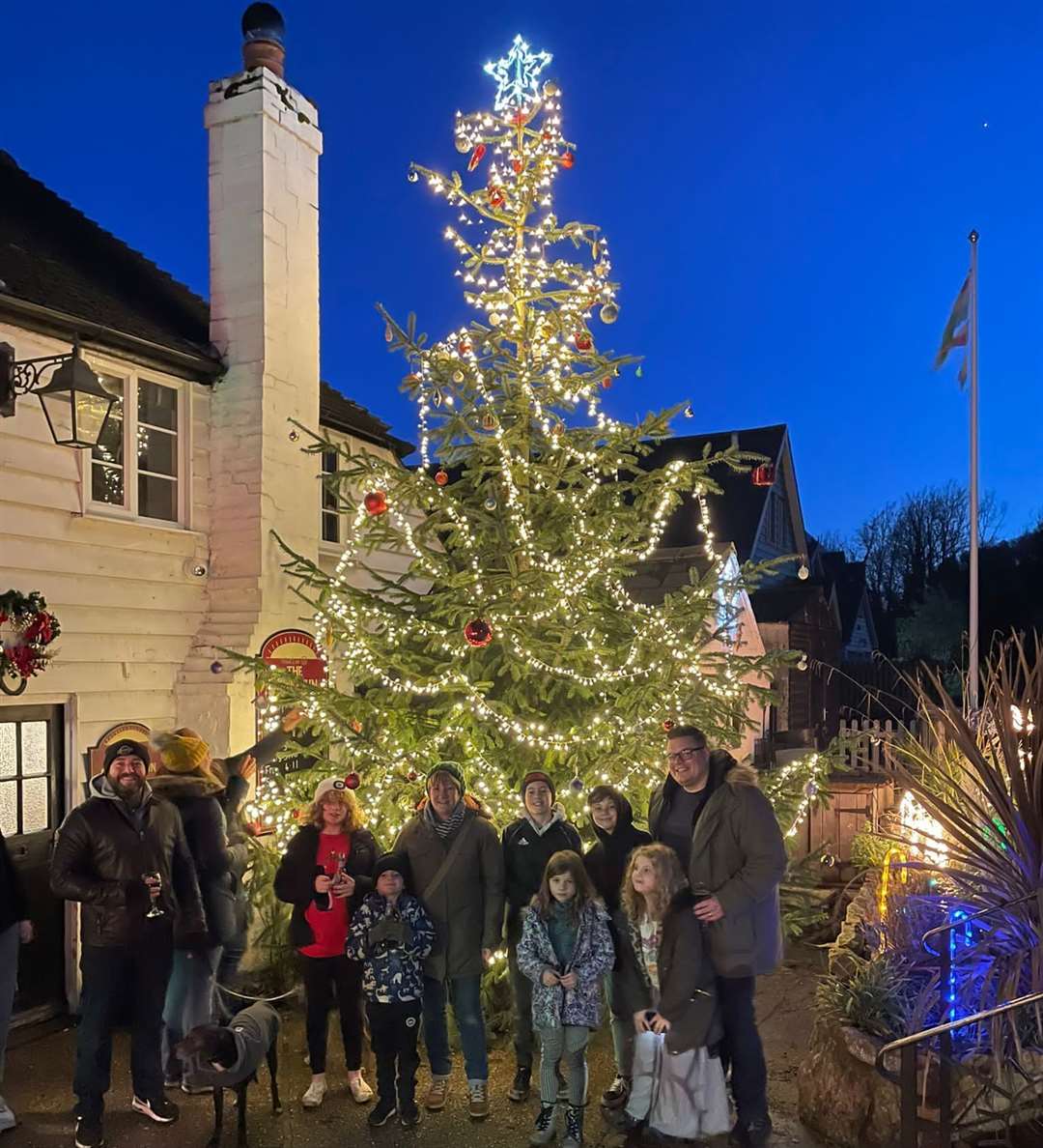 People are invited to pay to hang a bauble on the giant tree outside The Rising Sun in Kingsdown