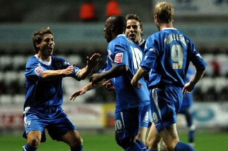 Delroy Facey celebrates a stunning goal with team mates at the Liberty Stadium. Picture by Matthew Walker