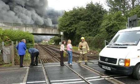 The emergency services shut down the rail line that runs past the warehouse. Picture: MATT WALKER
