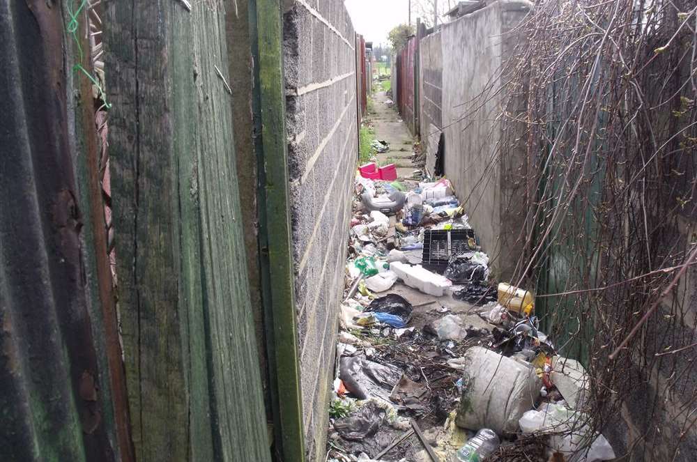 The state of an alleyway behind houses along Beresford Road, Northfleet.