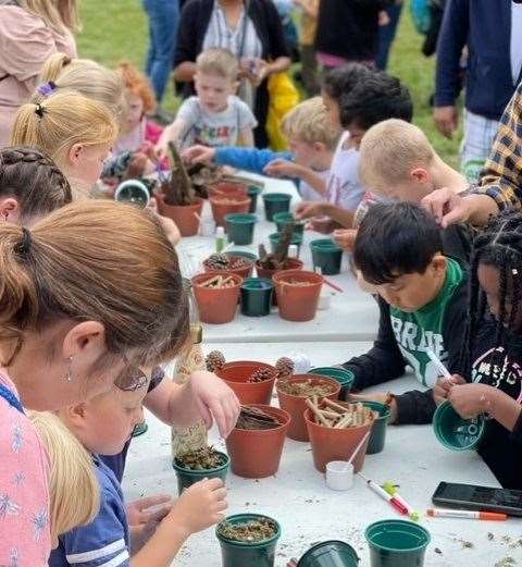 Children making bug hotels as part of a family fun day held at Dartford's Central Park