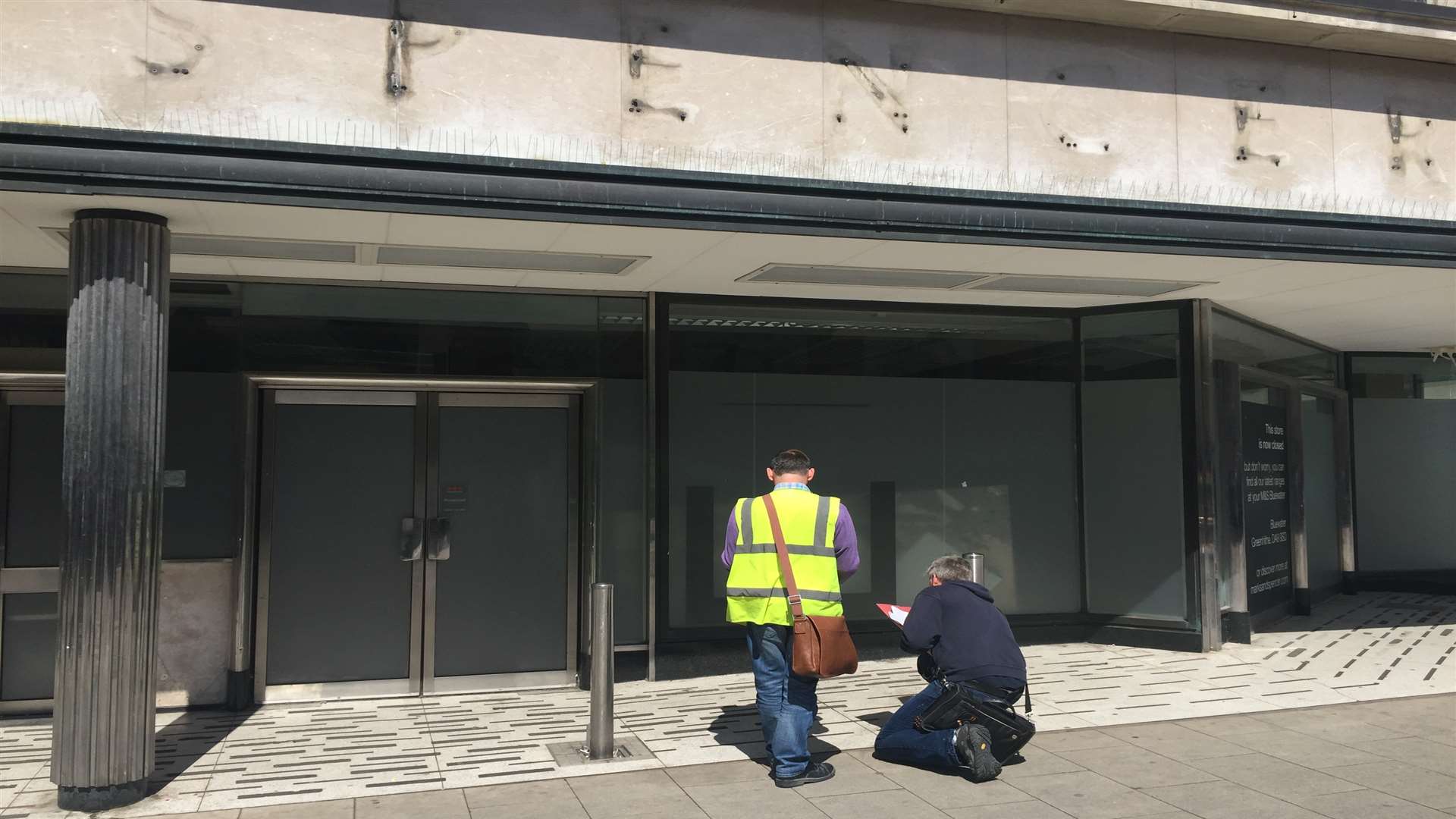 Contractors measuring up outside the old Marks and Spencer store in New Road