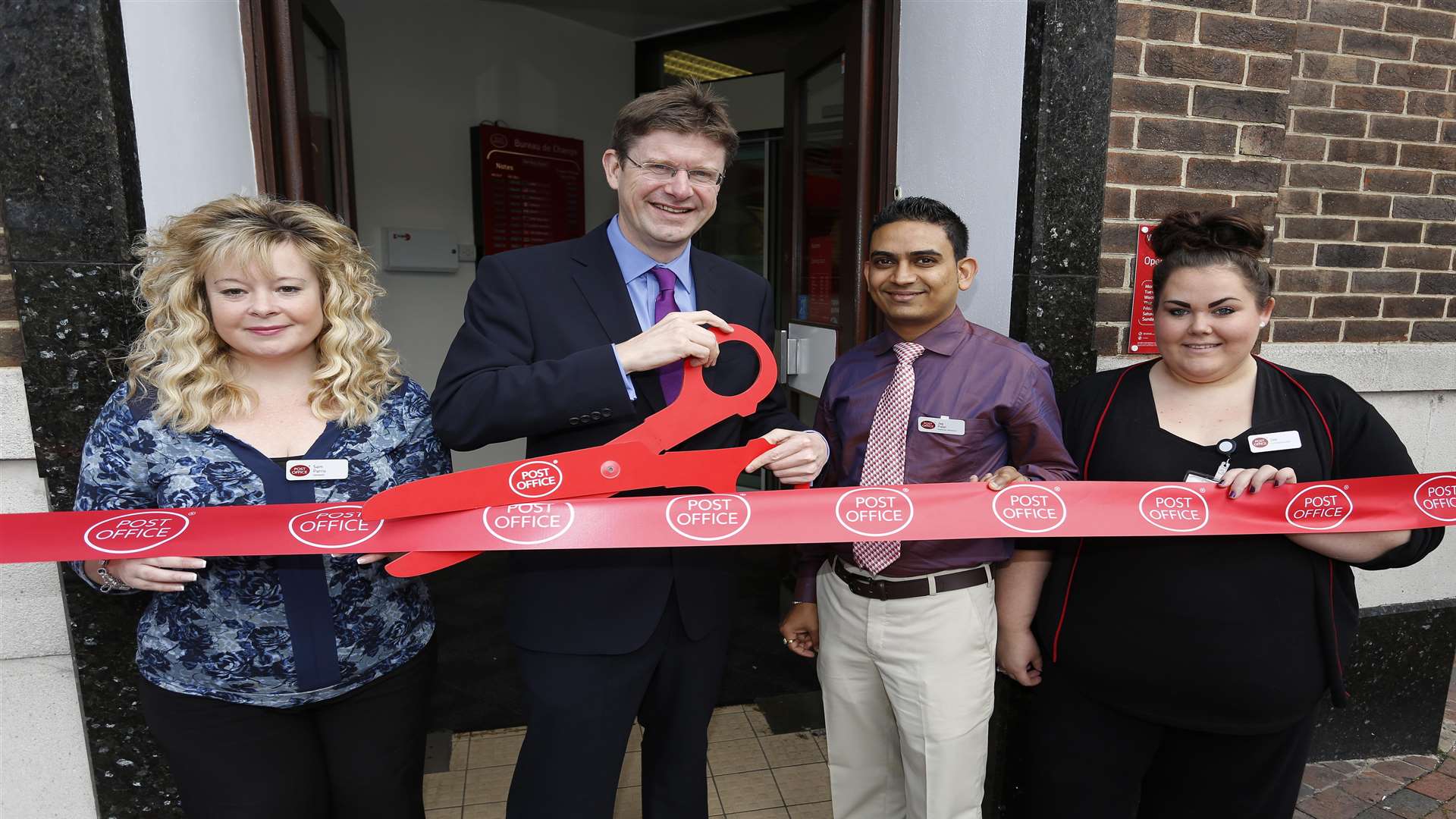 Five Ways Post Office Manager Sam Parris, MP Greg Clark, Financial Specialist Jag Patel and Mails Specialist Marisa Willoughby-Jones