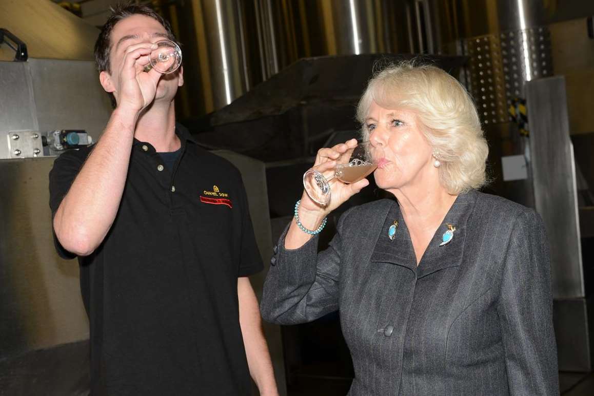 The Duchess samples a 0pressing of chardonnay grapes with Josh Donaghay-Spire