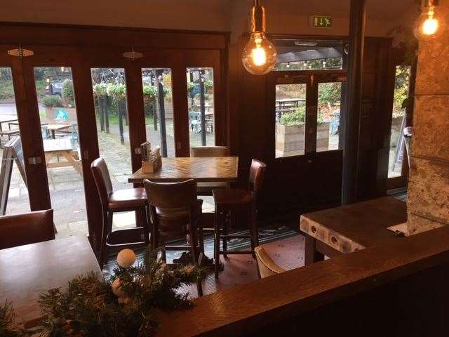 Folding glass doors at the front of the pub can be pulled aside in the summer to take full advantage of the better weather