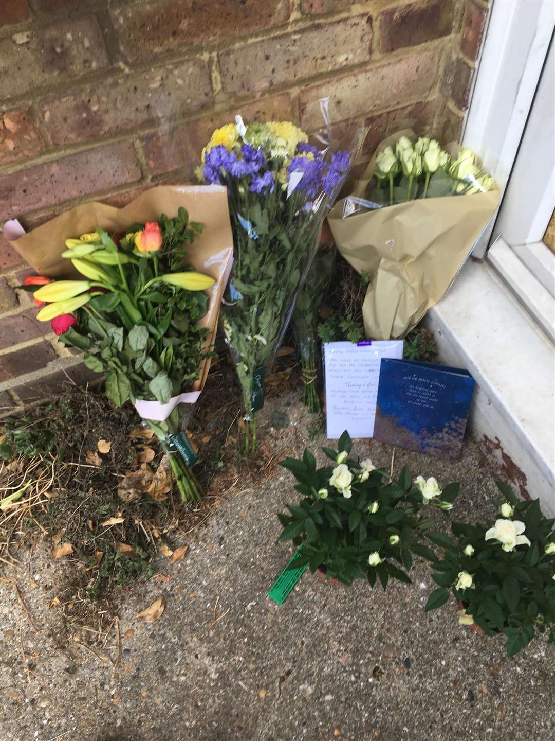Flowers and cards have been left ouside Chris' home. (4502694)