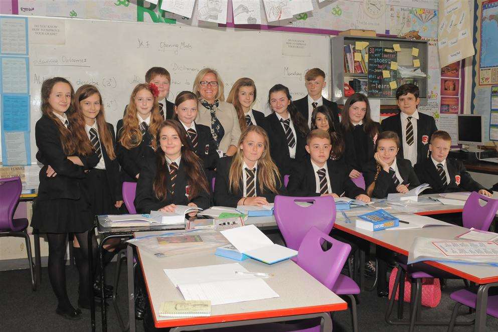 Head teacher Tina Bissett celebrates a good Ofsted with pupils