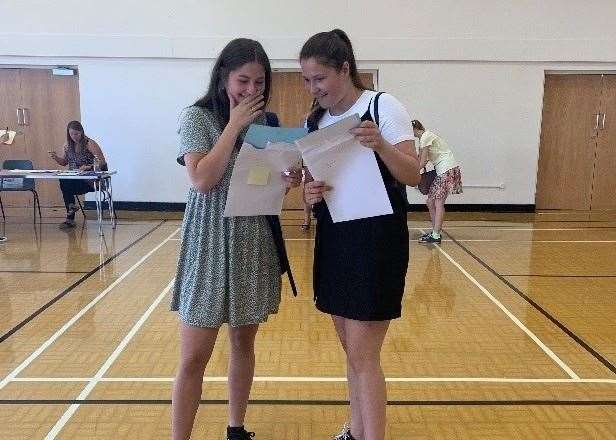 Olivia Pearn and Alex Pearn collecting their results at Highsted Grammar School