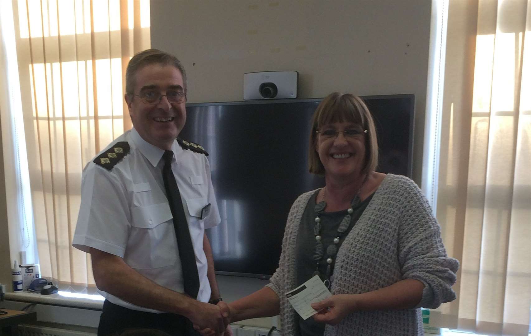 District commander ch insp Steve Barlow with Karen Griffiths of Dover Partnership Against Crime