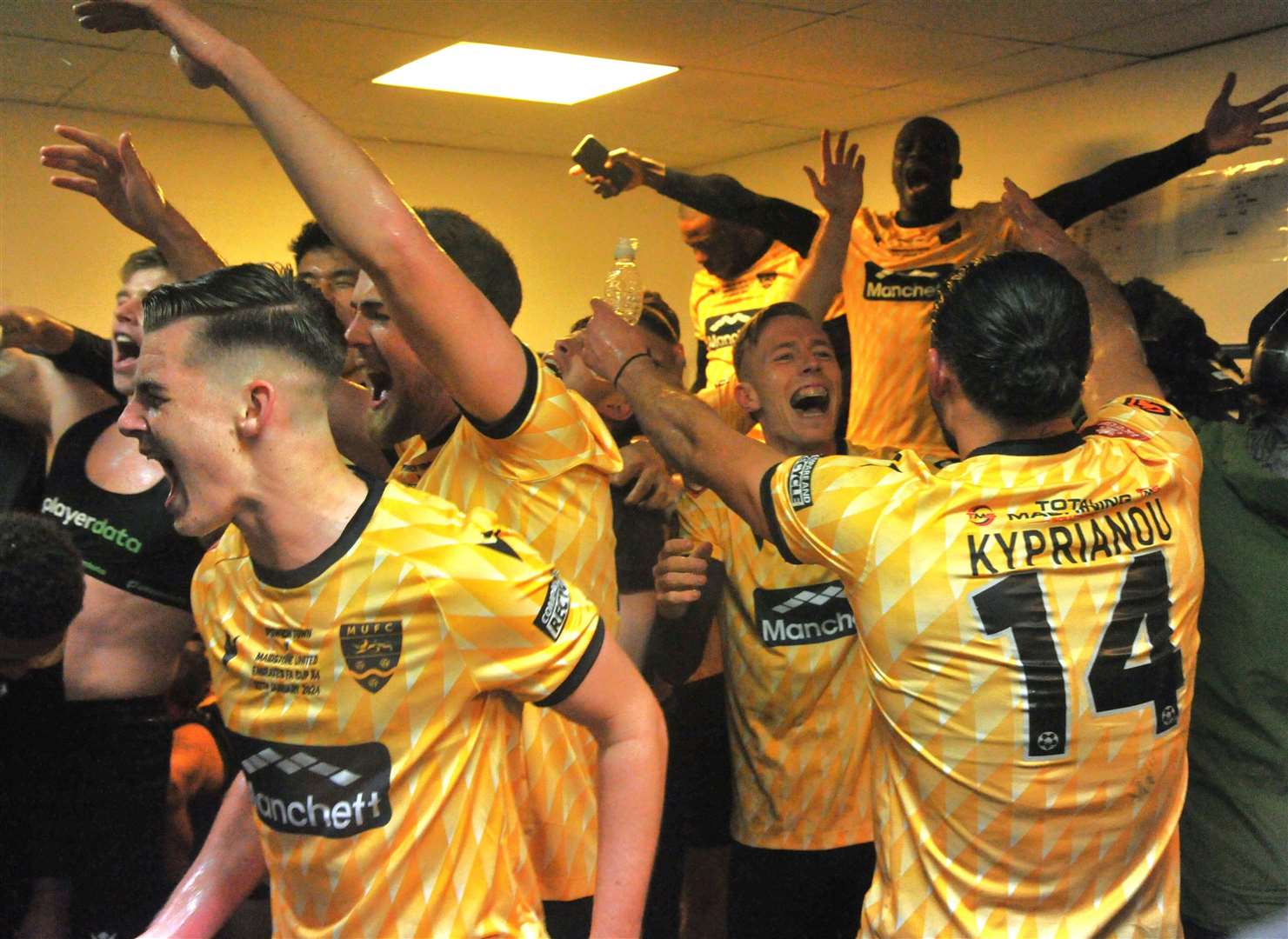 Dressing-room celebrations after Maidstone’s fourth-round win over Ipswich. Picture: Steve Terrell