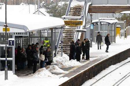 Passengers wait for the Southeastern High Speed train, the only service running through Rainham rail station.