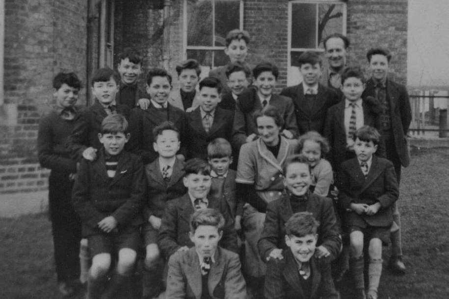 Young lads gather together for a photo with one of the staff at Farningham