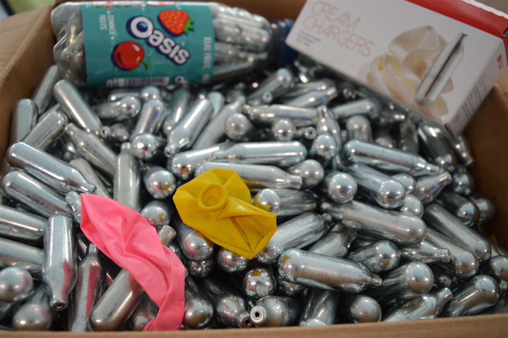 Nitrous oxide is ingested using small silver canisters and balloons