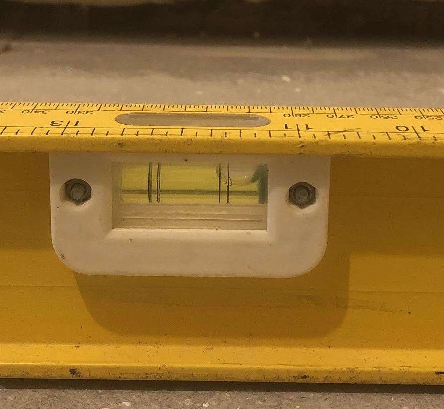 A spirit level showing how uneven the floors are in Michael and Marilyn Stapleton's Ramsgate home