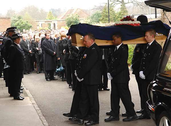 Paul Wilkins's coffin is carried into Eltham Crematorium. Picture: NICK JOHNSON