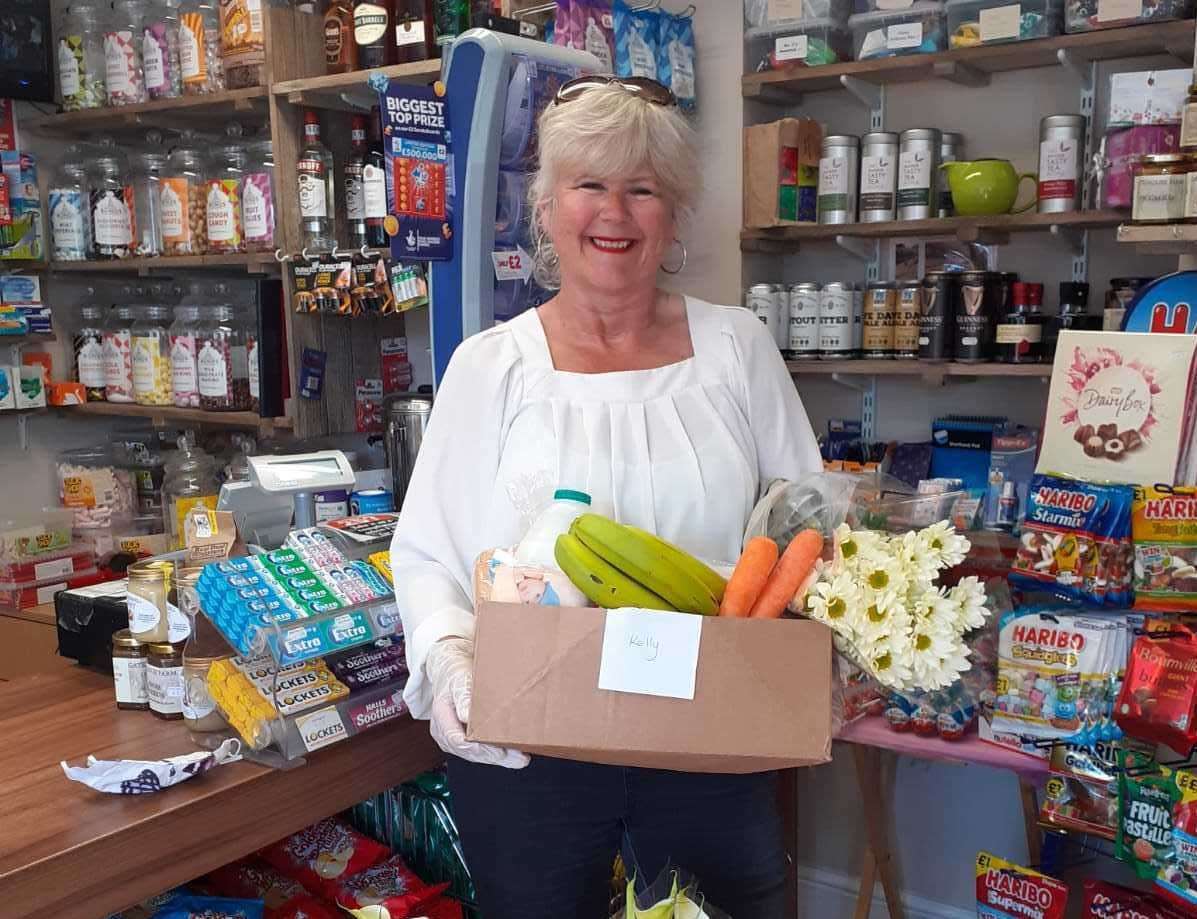 Tracy Carr with one of the boxes prepared by Sholden Village Store following a grant in May