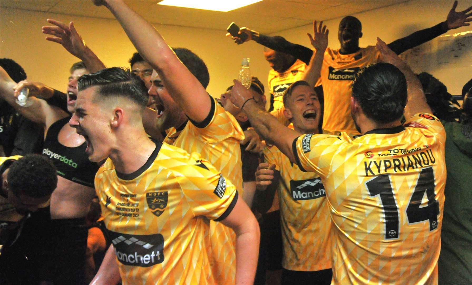 Post-match celebrations inside the Maidstone dressing room after they beat Ipswich Town in the FA Cup Fourth Round. Picture: Steve Terrell