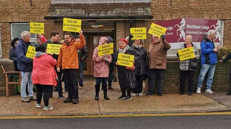 People protesting about the sudden closure of Blackburn Lodge care home