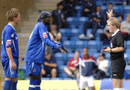 SEEING RED: Efe Sodje leads the protests as Simon King (left) is dismissed by referee Gavin Ward. Picture: MATTHEW READING