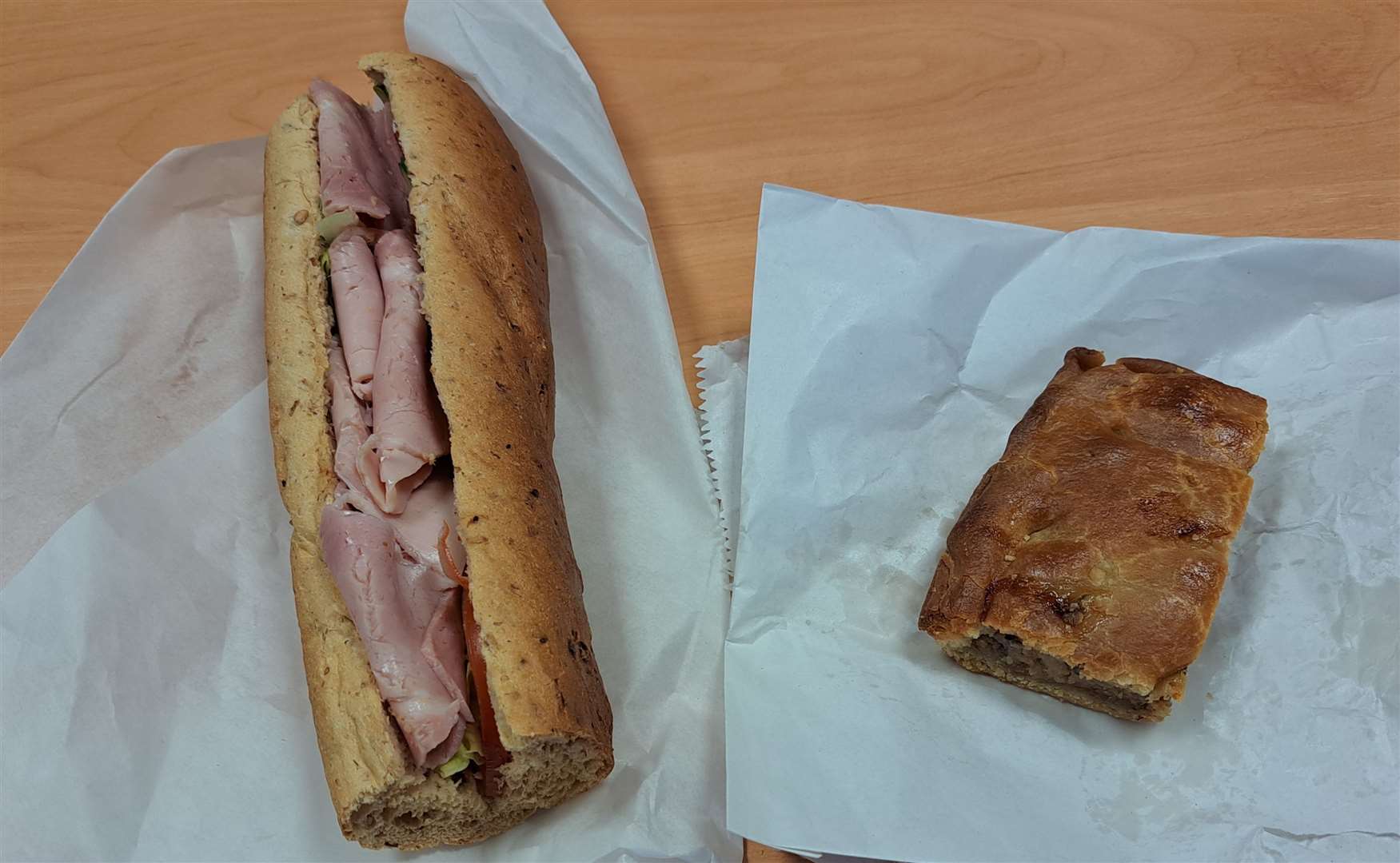 Sam Lennon's daily lunch from Tucked Away, ham salad stick and a slice of sausage pie