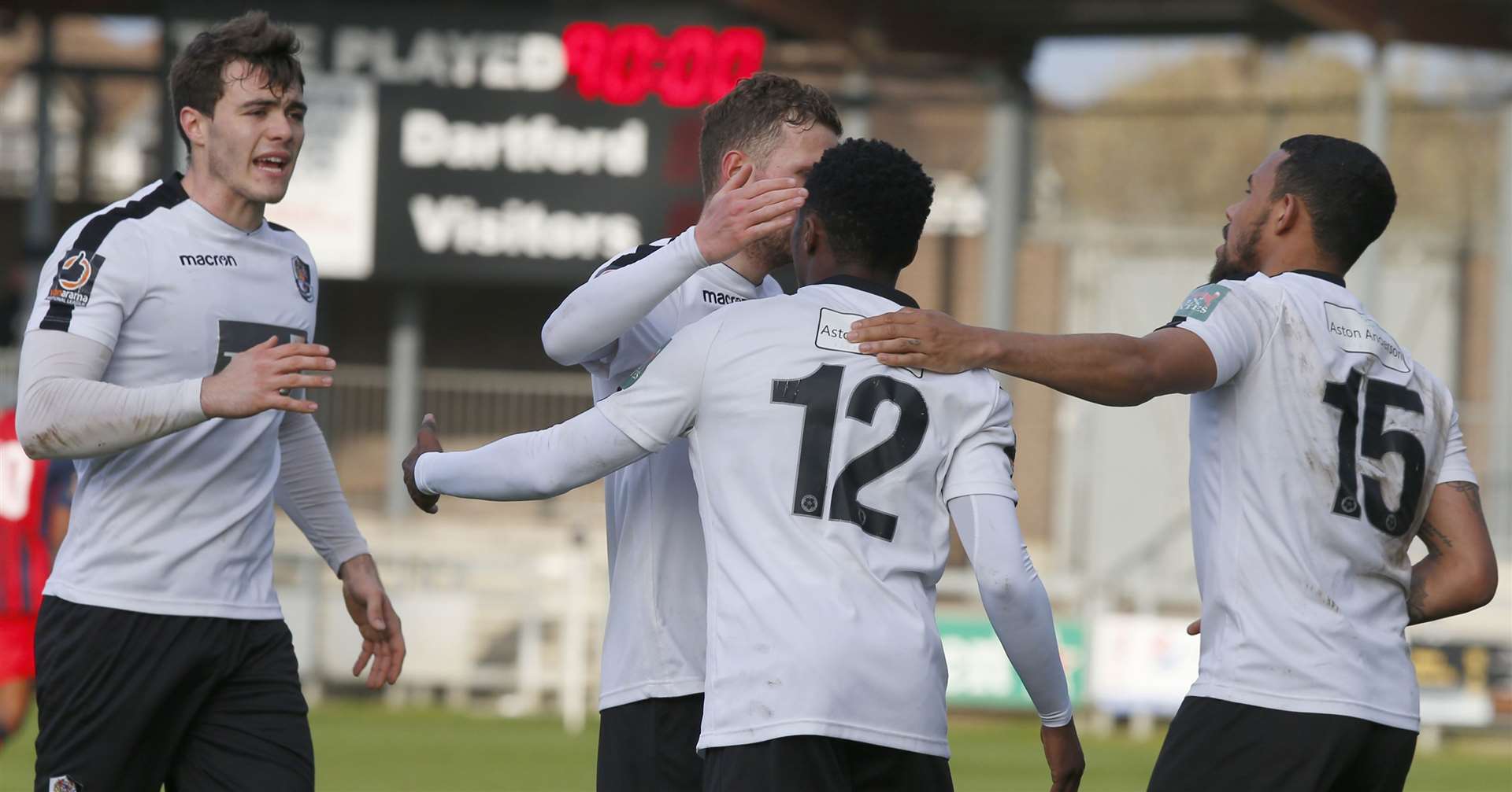 Darren McQueen is congratulated by his team-mates after a late deflected equaliser for Dartford on Saturday. Picture: Andy Jones