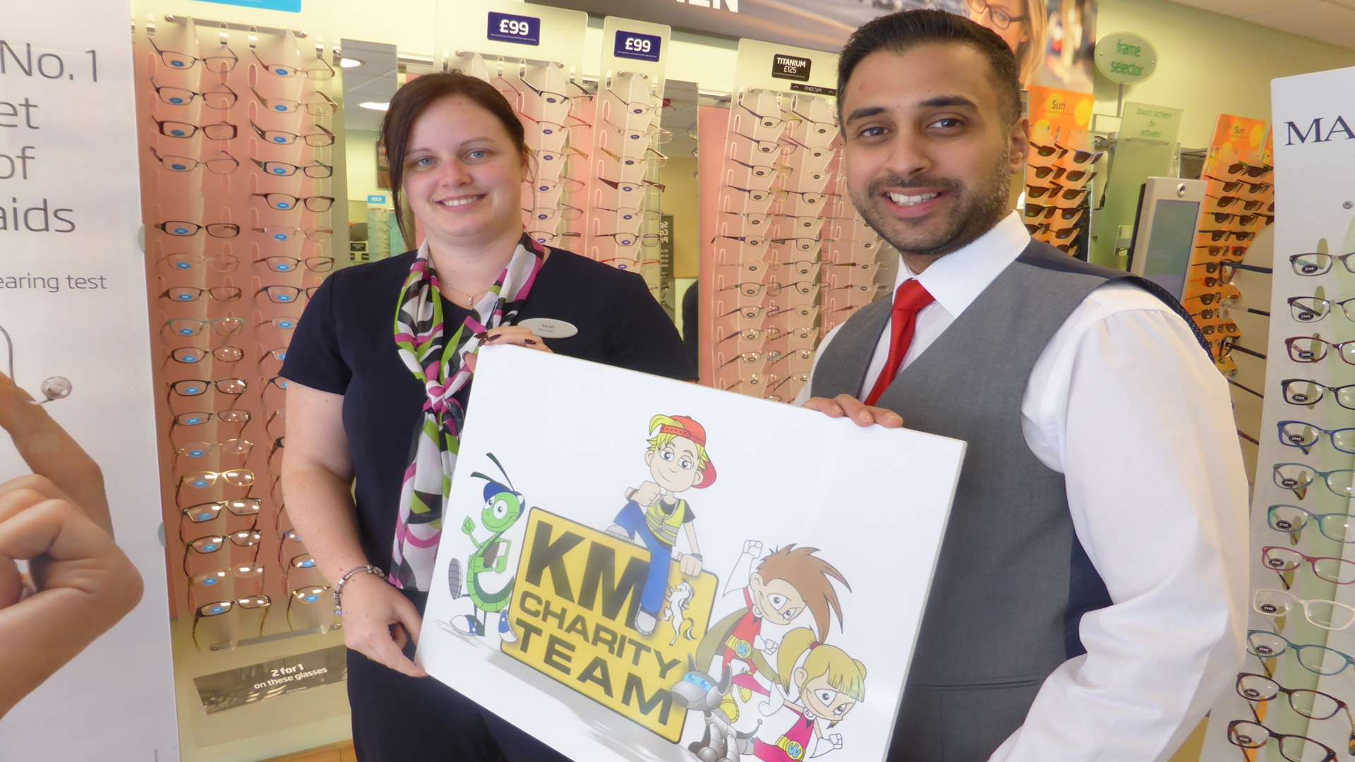 Specsavers Dover Manager Sarah Kittlety and Director Pritin Patel showcase support for KM Walk to School