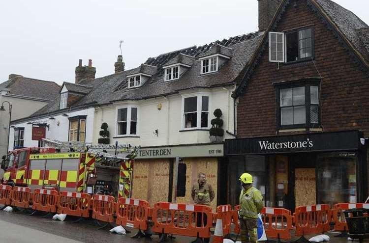 Firefighters in Tenterden in the aftermath of the fire. Picture: Gary Browne