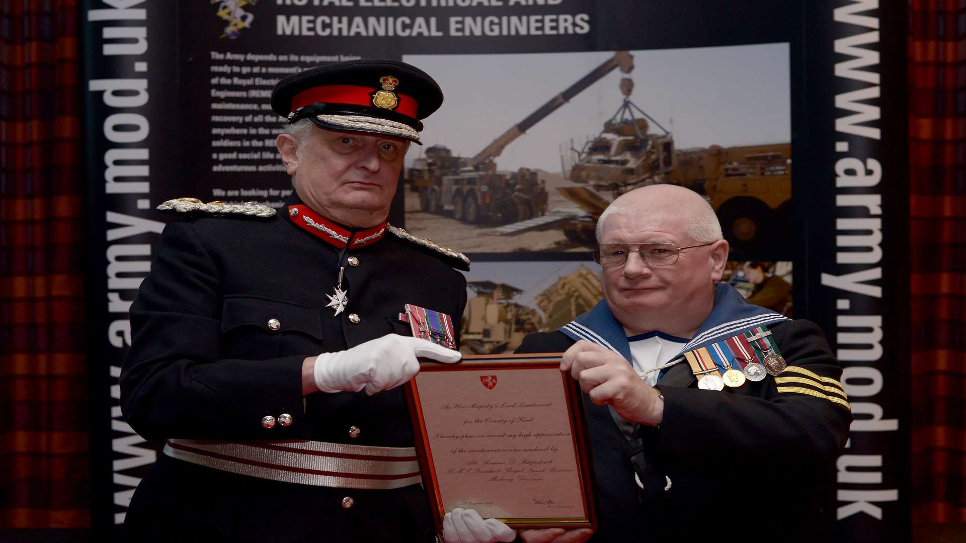 The Lord-Lieutenant of Kent, Viscount De L’Isle MBE presents Able Seaman David Fitzpatrick with a Certificate for Meritorious Service in recognition of his outstanding loyalty and commitment to the Reserve Forces.