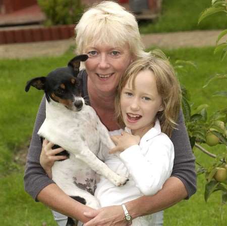 JOY: Maisie is reunited with Lorraine Deadman and her seven-year-old daughter Mollie. Picture: TERRY SCOTT