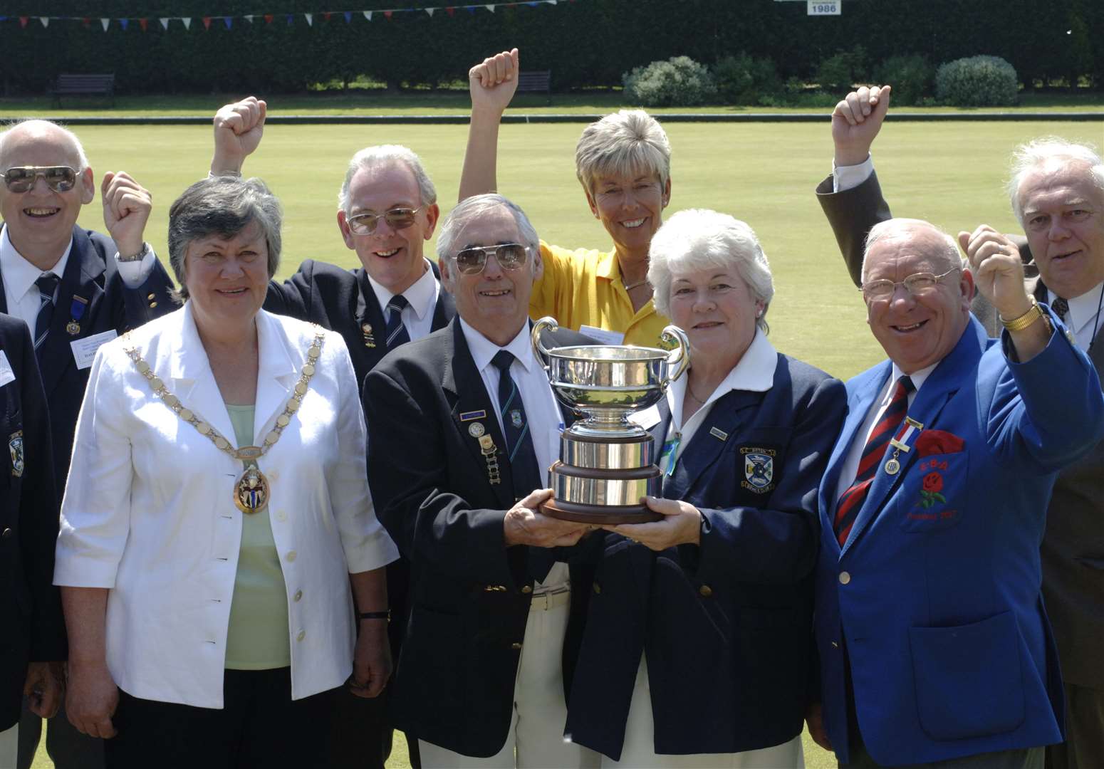 Cllr Mulcuck and ladies captain Chris Parker with their hands on the trophy as Ditton Bowls Club is named the second best club in the country in 2007. Picture: John Wardley