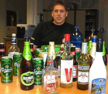 PC Chris Stephens with the seized alcohol.