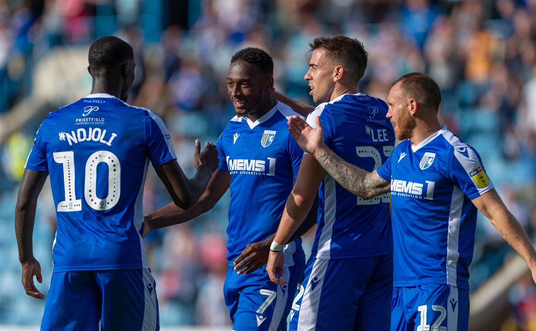 Gillingham's Mikael Ndjoli thanks Brandon Hanlan for his assist against Wycombe. Picture: Ady Kerry