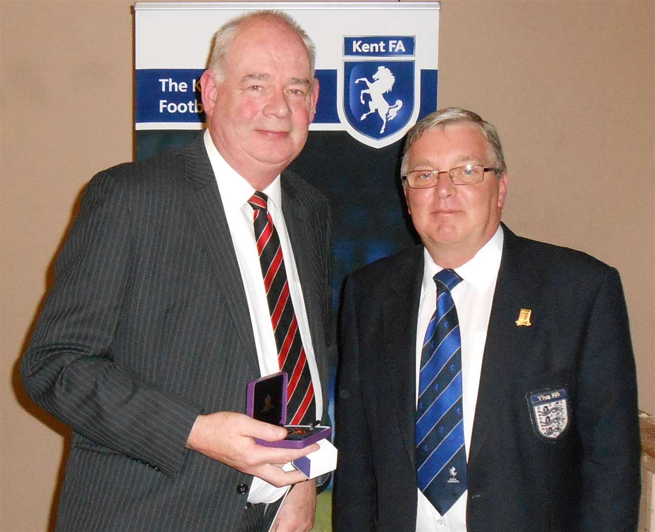 Former Ebbsfleet United secretary Peter Danzey received his FA 50-year long service award at the 2013 Kent FA annual meeting.. Picture: Andy Fairhurst