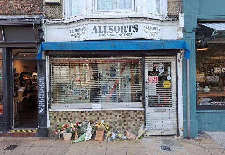 Floral tributes for Jason Down at his Allsorts shop in Deal high street