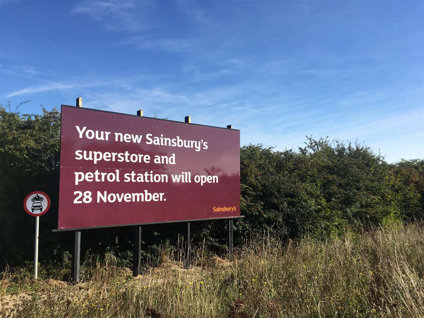 The sign outside Altira Business Park showing Sainsbury's opening date (4199025)