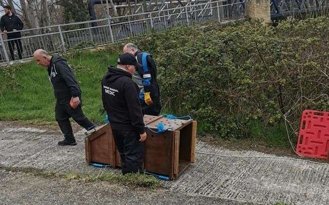 Volunteers from the British Divers Marine Life Rescue attempt to rescue "Bradley" the seal from the River Medway in Maidstone. Picture: Marica Brunger