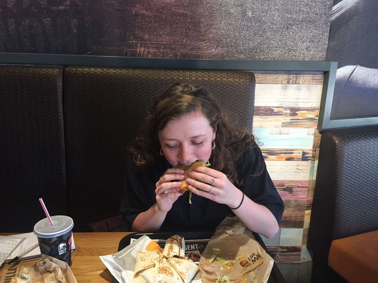 Rebecca tucking into a beef taco