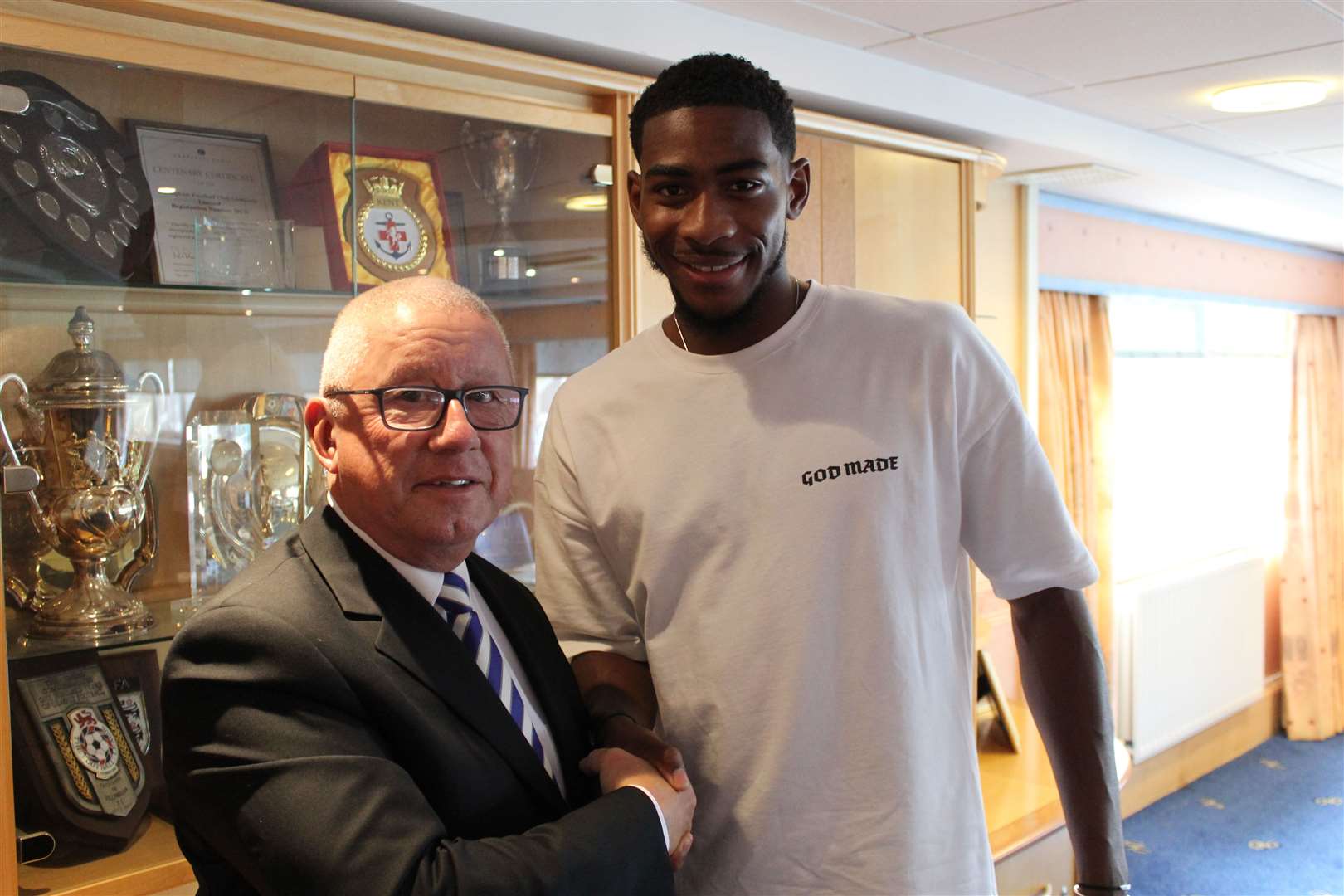 Gillingham chairman Paul Scally welcomes new signing Zech Medley to the club Picture: @TheGillsFC