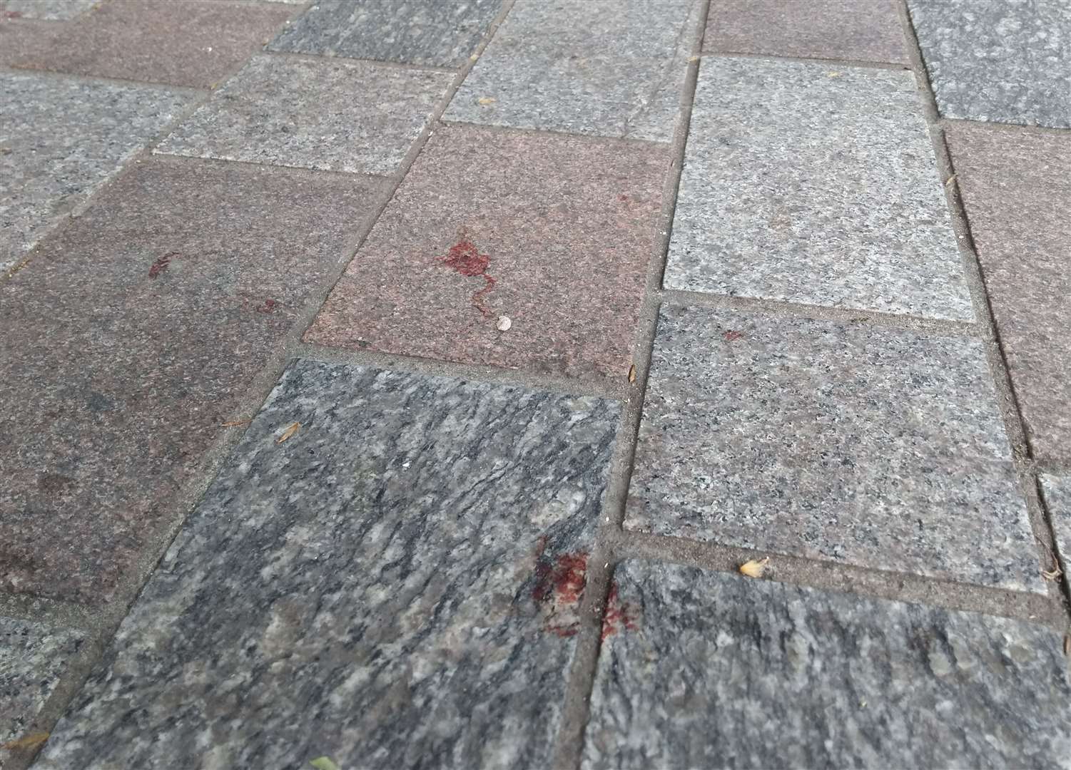 Blood at the scene of as assault in Remembrance Square, Maidstone