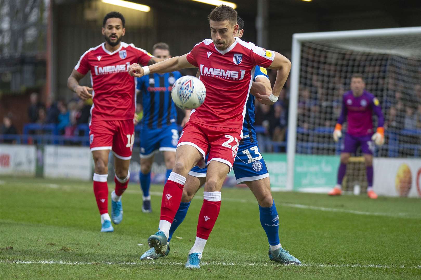 Gillingham's Olly Lee holds off Jimmy Keohane at Rochdale on Saturday. Picture: Julian Hart