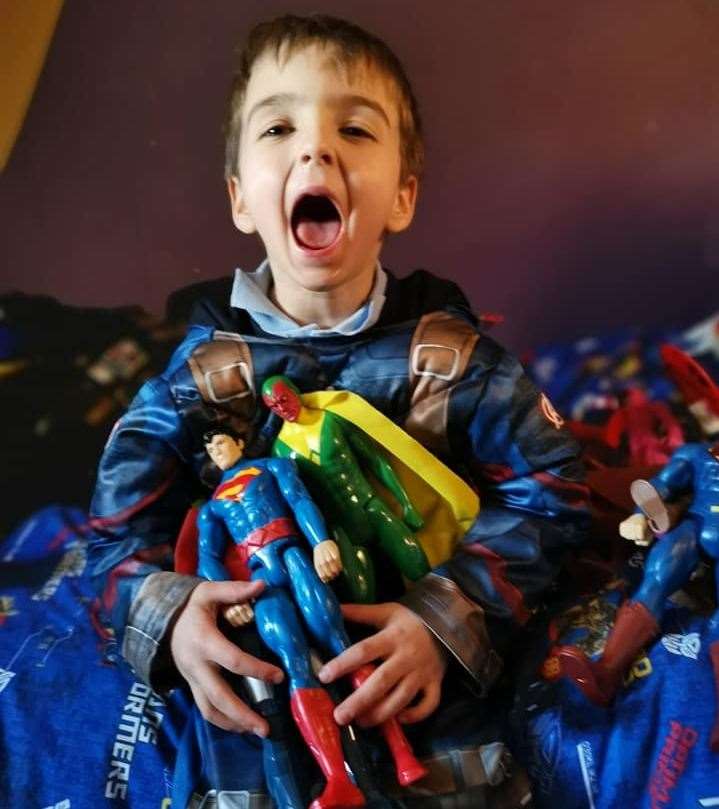 Caleb with his new toys donated by the public