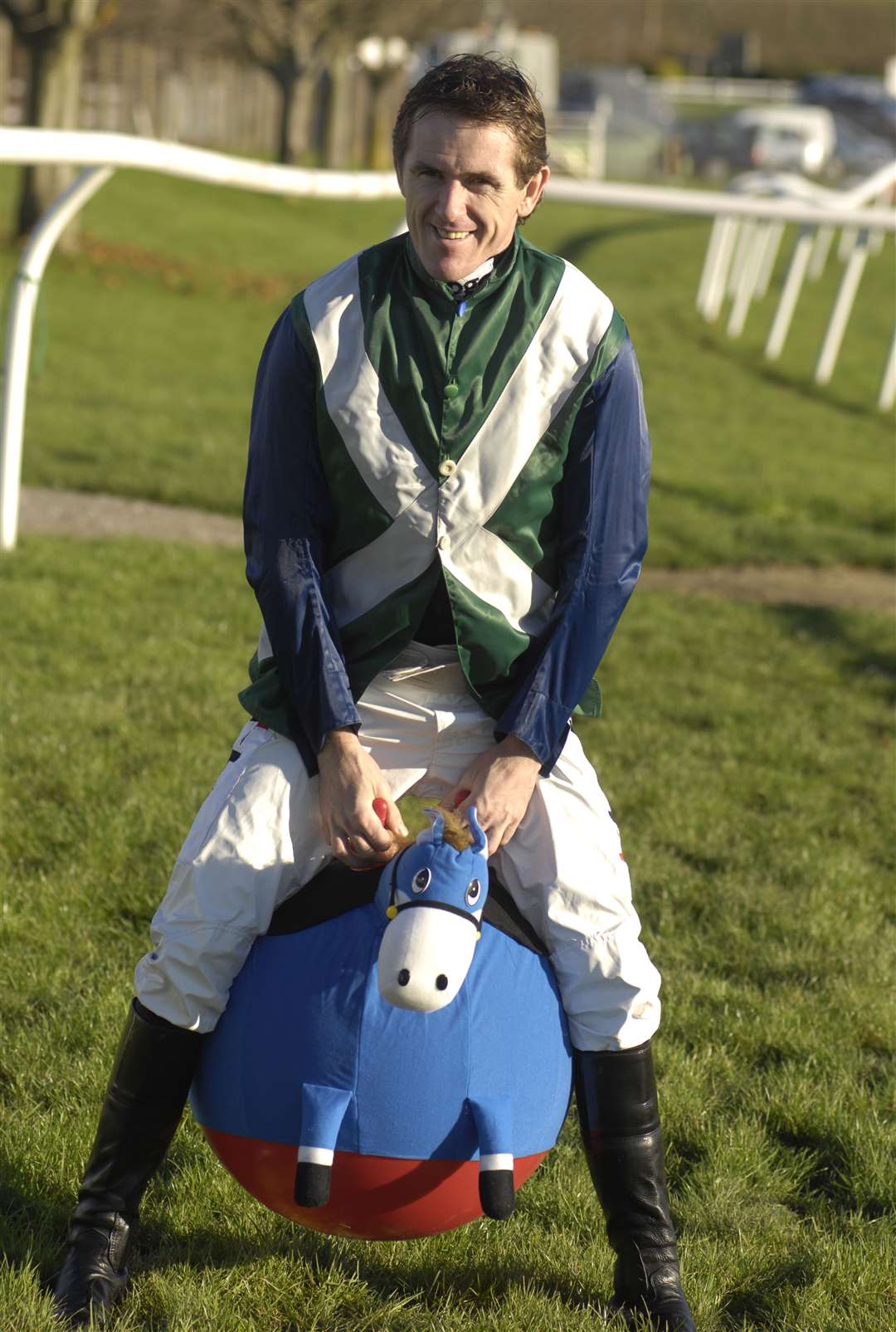 Champion jockey Tony McCoy is more used to riding horses than spacehoppers, but the Northern Irishman took part in a charity event at the track which raised £1,300 for Children in Need in November 2010