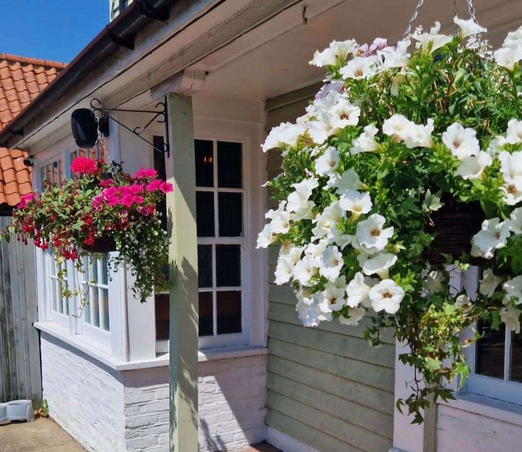 Hanging baskets are a 'labour of love' at the revamped historic pub