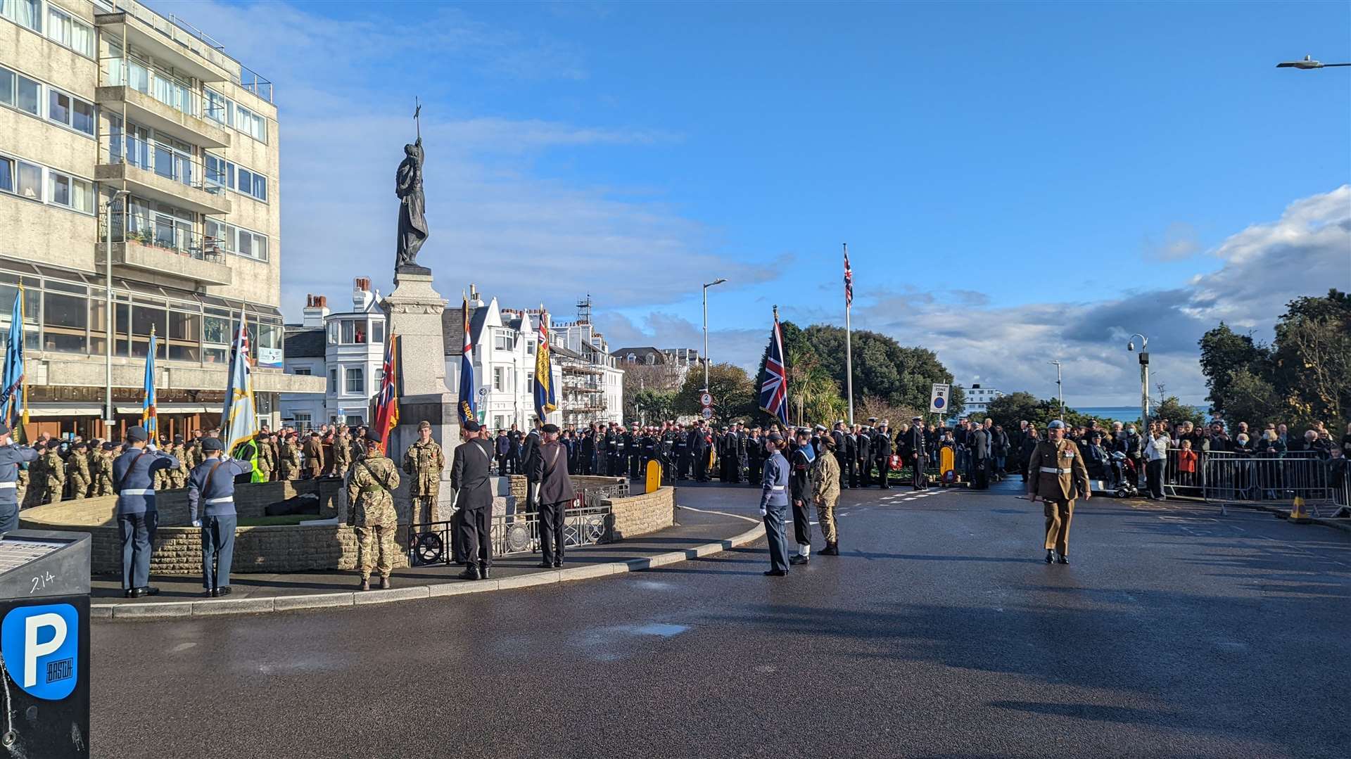 Folkestone residents gather around memorial
