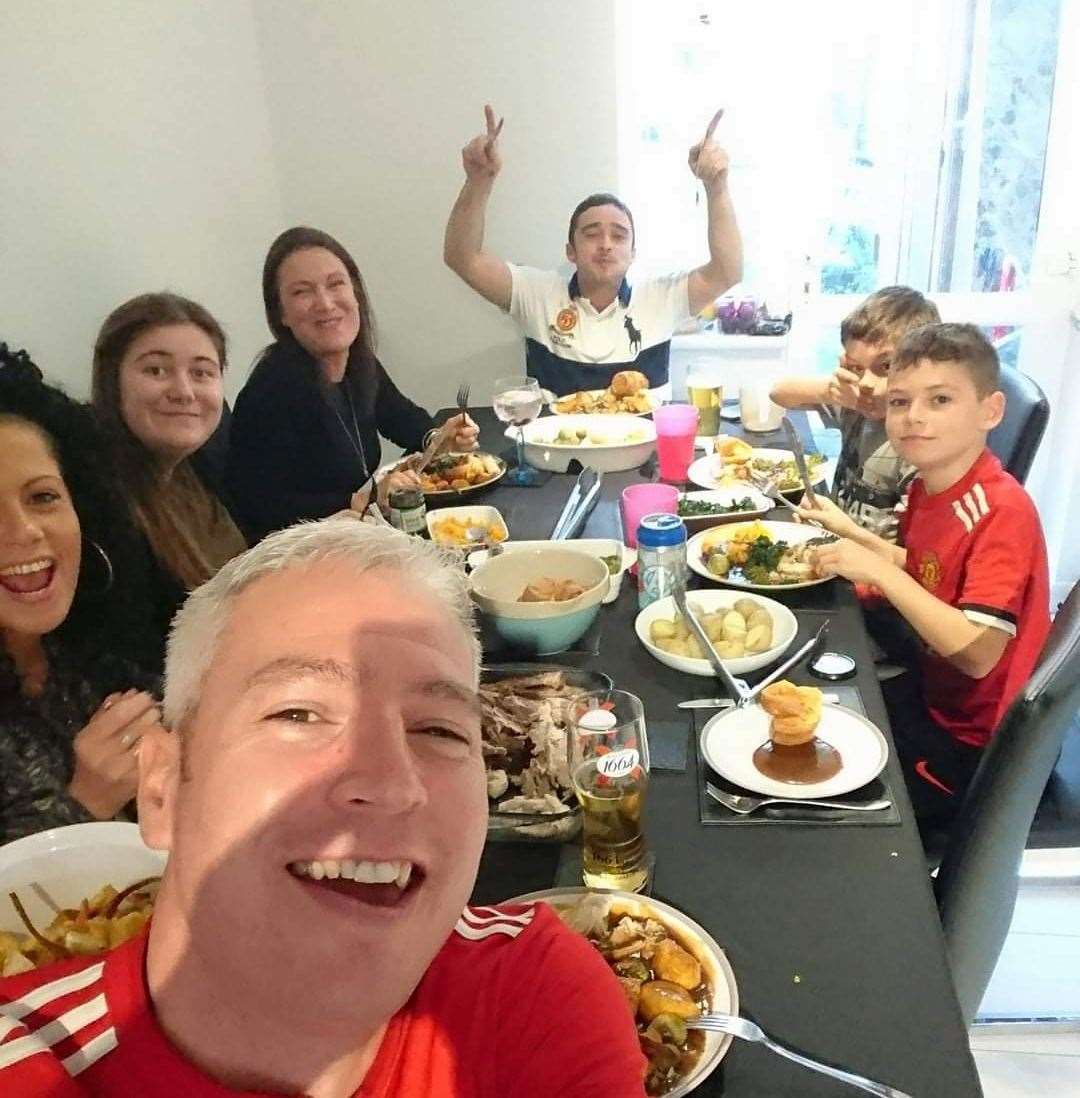 David Archer and his family including brother-in-law Aaron Hardy (bottom) enjoying a family roast dinner