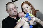 Rick Flynn and Joanna Hallett with newborn son Owen