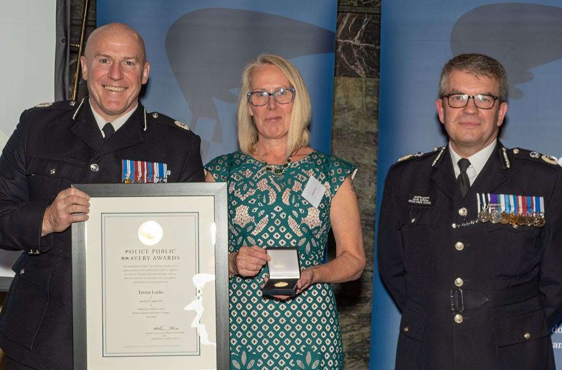 Teresa Locke receiving her award from ACC Andy Pritchard (left) and NPCC chairman, Martin Hewitt (right). Picture: Kent Police
